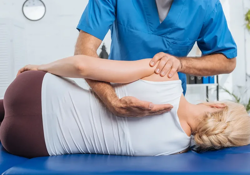 Hands-on manual therapy on a treatment table