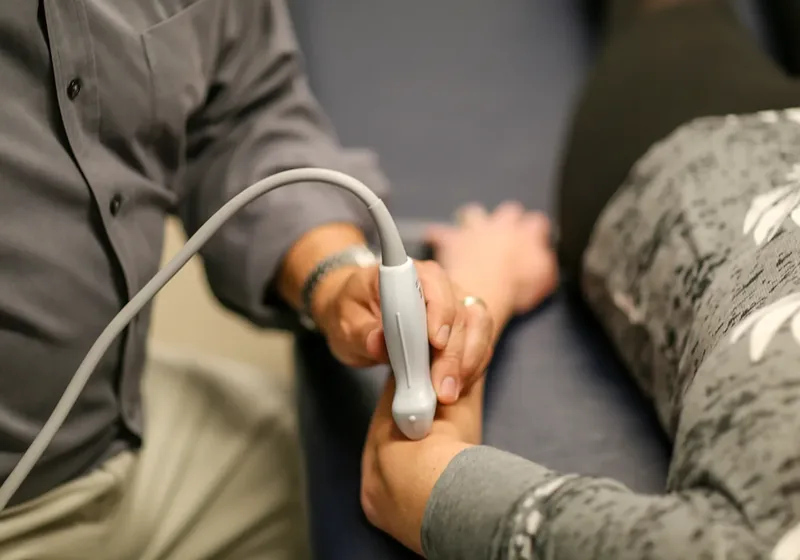 Ultrasound probe imaging a patient's knee